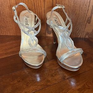 Silver, size 7-1/2, worn twice. Originally $69. Excellent condition.